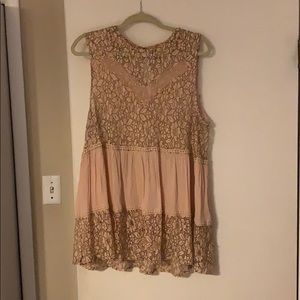 Sheer lace embroidered sleeveless blouse.